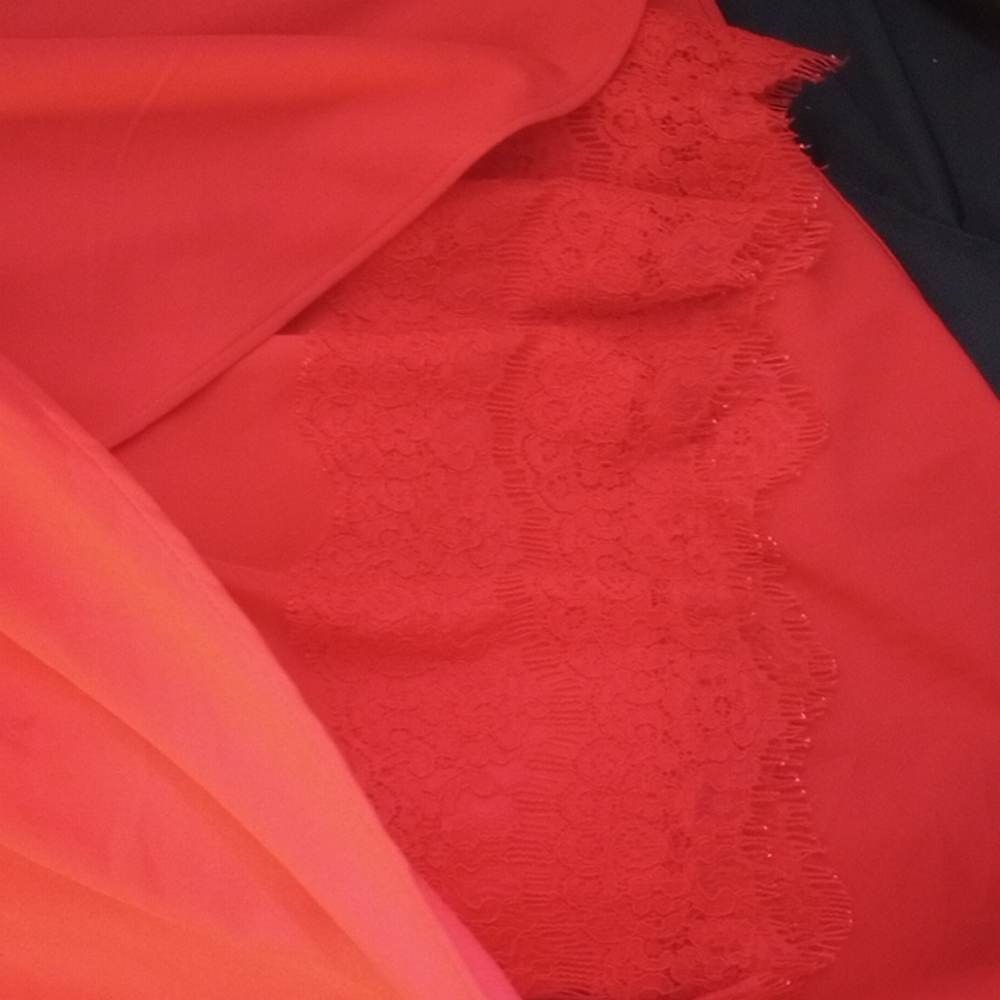 Red dress, red lace underneath, angled longer left side, adjustable straps